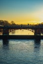 Rowers Silhouetted at Sunrise Behind a Bridge on the River Clyde in Glasgow Scotland Royalty Free Stock Photo