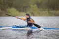 Rowing base.Training in rowing.Teenager in a sports boat with oars Royalty Free Stock Photo