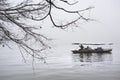 Rowing boat and branch at West Lake in winter, Hangzhou Royalty Free Stock Photo