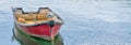 Rowing boat moored in harbour, England