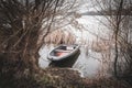 Rowing boat is moored on the shore of a frozen lake Royalty Free Stock Photo