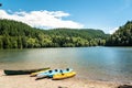 Rowing boat on a sandy beach on a mountain lake Royalty Free Stock Photo