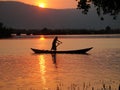 Rowing Boat Silhouette on Tropical River Royalty Free Stock Photo