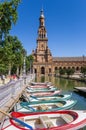 Rowing boats in front of the tower at Plaza Espana in Sevilla Royalty Free Stock Photo