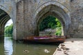 Rowing boats lined up on the Wear river in the city centre of Durham Royalty Free Stock Photo