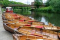 Rowing boats lined up on the Wear river in the city centre of Durham