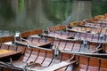 Rowing boats lined up on the Wear river in the city centre of Durham Royalty Free Stock Photo