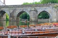 Rowing boats lined up on the Wear river in the city centre of Durham Royalty Free Stock Photo