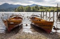 Rowing boats on shore of Derwent Water, Keswick. Royalty Free Stock Photo