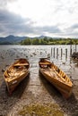 Rowing boats on shore of Derwent Water, Keswick. Royalty Free Stock Photo