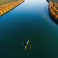 rowing on a calm lake in aerial view only small boat visible with serene water around lot of empty copy space for Royalty Free Stock Photo