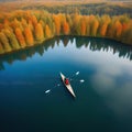 rowing on a calm lake in aerial view only small boat visible with serene water around lot of empty copy space for Royalty Free Stock Photo