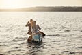 Rowing our boat gently on the lake. a young couple rowing a boat out on the lake. Royalty Free Stock Photo