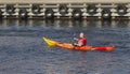 Rowman rowing a kayak