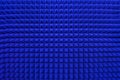 Rows of acoustic music soundproof foam pyramid panel with blue lighting