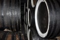 Rows of alcohol barrels in a warehouse of a factory for the production of cognac, whiskey, wine, brandy Royalty Free Stock Photo