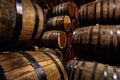 Rows of alcoholic drums in stock. Distillery. Cognac, whiskey, wine, brandy. Alcohol in barrels Royalty Free Stock Photo