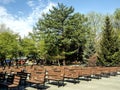 rows of benches in the city park near the stage on a spring morning Royalty Free Stock Photo