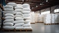 Rows of big white sacks at large warehouse in modern factory Royalty Free Stock Photo