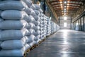 Rows of big white sacks at large warehouse in modern factory Royalty Free Stock Photo