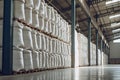 Rows of big white sacks at large warehouse in modern factory Royalty Free Stock Photo