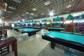 Rows of billiard tables inside club with fences Royalty Free Stock Photo
