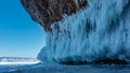 Rows of bizarre icicles hang from the base of the granite rock.