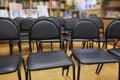 Rows of black chairs Royalty Free Stock Photo