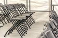 Rows of black folding chairs empty Royalty Free Stock Photo