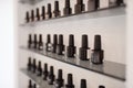 Rows of black nameless nail varnish bottles