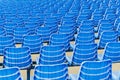 Rows of blue plastic chairs on a metal base. Back view Royalty Free Stock Photo