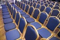 Rows of blue seats in unknown event hall Royalty Free Stock Photo