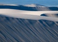 Rows Blue and white Sand duneson the West Coast of Southern Africa with Atlantic Ocean in the background