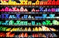 Rows of brightly coloured pencils on a display rack.