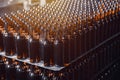 Rows of brown glass beer bottles on the stack. Rows of brown glass. Royalty Free Stock Photo