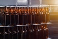 Rows of brown glass beer bottles on the stack. Rows of brown glass.