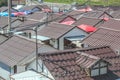 Rows of brown triangular roofs