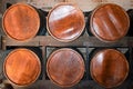 Rows of brown wooden alcohol barrels Royalty Free Stock Photo