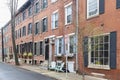 Rows of brownstone apartment buildings in Center City with chairs, stoops and planters in Pennsylvania