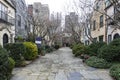 Rows of brownstone apartment buildings in Center City with windows, stoops and plant bushes in Pennsylvania