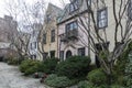 Rows of brownstone apartment buildings in Center City with windows, stoops and plant bushes in Pennsylvania