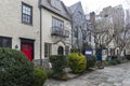 Rows of brownstone apartment buildings in Center City with windows, stoops and plant bushes in Pennsylvania