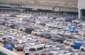 Rows of busy cars corporate parking lots in shopping malls in urban city. Full space design area in transportation concept.