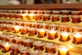 Rows of Candles Lit On Alter