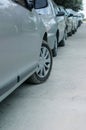 Rows of cars parked on the side of the road in a residential are