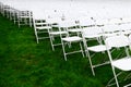 Rows of chairs form a beautiful pattern on the grass land Royalty Free Stock Photo