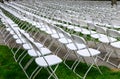 Rows of chairs form a beautiful pattern on the grass land Royalty Free Stock Photo
