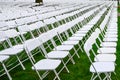 Rows of chairs form a beautiful pattern on the grass land Royalty Free Stock Photo