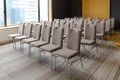 Rows of chairs near window in conference hall Royalty Free Stock Photo