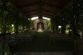 Rows of chairs at an outdoor wedding ceremony, Mexican hacienda oudoor chapel